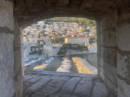Window at the top of the Tvrdava Svetog Ivana fortress, with a view on the Old Port and the Revelin Fortress