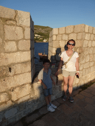 Miaomiao and Max at the top of the Tvrdava Svetog Ivana fortress, with a view on an old ship