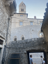 Tim at a gate at the east side and tower of the Dominican Monastery at the Ulica Svetog Dominika street