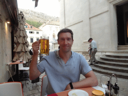 Tim with a Karlovacko beer at the terrace of the Konoba Saint Blaise restaurant at the Zeljarica Ulica street