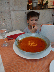Max with soup and bread at the terrace of the Konoba Saint Blaise restaurant at the Zeljarica Ulica street