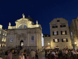 Front of St. Blaise`s Church and the La Bodega Dubrovnik restaurant at the Stradun street, by night