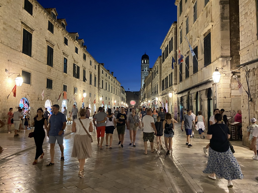 The west side of the Stradun street with the tower of the Franciscan Church, by night