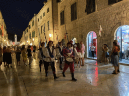 Guards at the Stradun street and the Bell Tower, by night