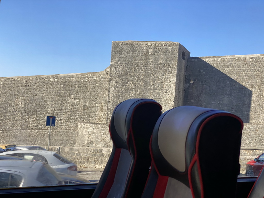 The northern city walls with the Kula sv. Lucija fortress, viewed from the tour bus to Perast on the Ulica Maria Perica street