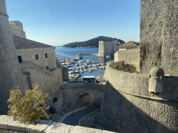 The Revelin Fortress, the Revelin Bridge, the Old Port, the Porporela Pier, the Tvrdava Svetog Ivana fortress and the Lokrum island, viewed from the tour bus to Perast on the Ulica Iza Grada street