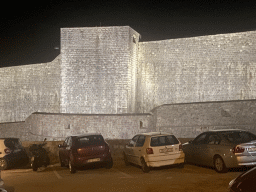 The northern city walls with the Kula sv. Lucija fortress, viewed from the tour bus from Perast on the Ulica Maria Perica street, by night