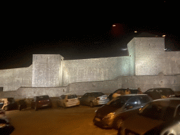 The northern city walls with the Kula sv. Lucija fortress and the Kula sv. Barbara fortress, viewed from the tour bus from Perast on the Ulica Maria Perica street, by night