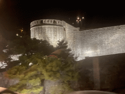 The northern city walls with the Kula sv. Jakov fortress, viewed from the tour bus from Perast on the Ulica Maria Perica street, by night