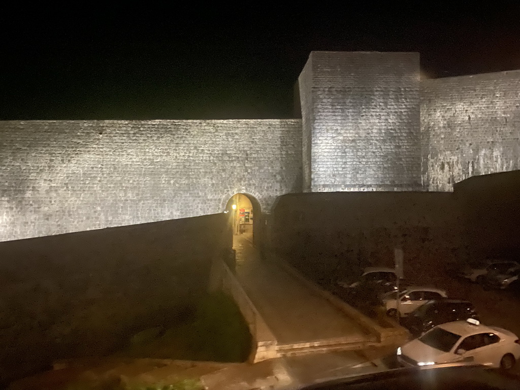 The northern city walls with the Bua Gate, viewed from the tour bus from Perast on the Ulica Maria Perica street, by night