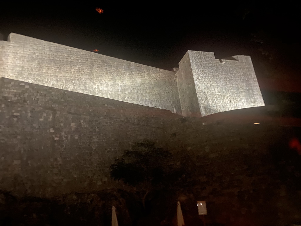 The northwestern city walls, viewed from the tour bus from Perast on the Ulica Iza Grada street, by night