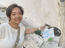 Miaomiao with the `Johny the Boss` cat at the Jesuit Stairs