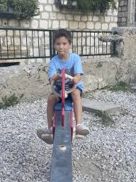 Max on a seesaw at the Old City Playground at the Ulica od Katela street