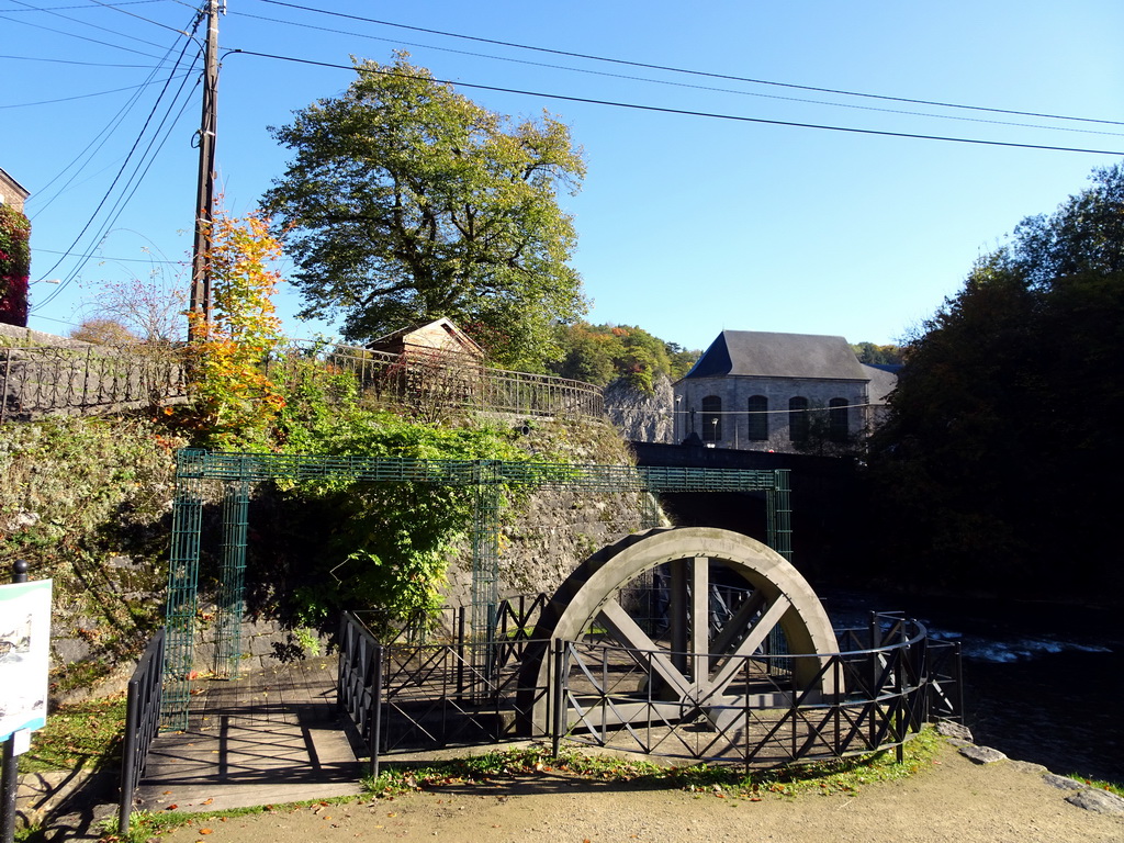 Water mill, the Ourthe river and the Église Saint-Nicolas church, viewed from the parking place of the Topiary Park