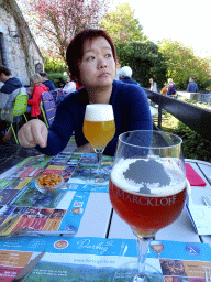 Miaomiao and a Marckloff beer at the La Ferme au Chêne restaurant