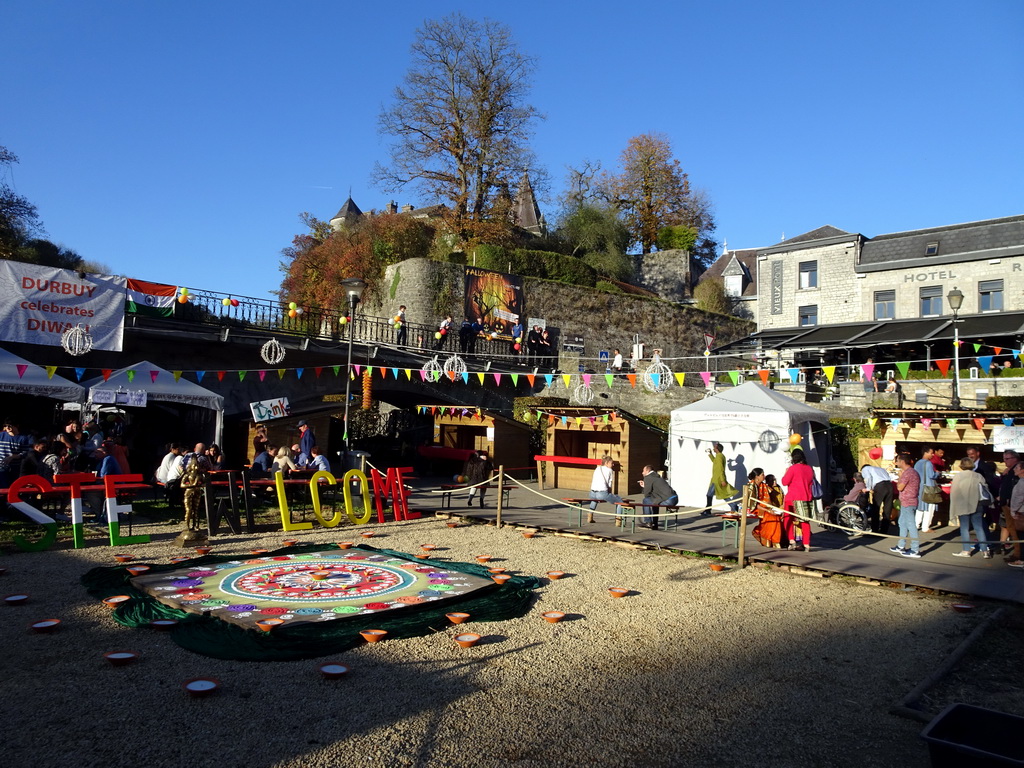 South side of the Place aux Foures square with decorations for the Diwali festival and the Durbuy Castle