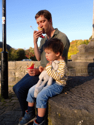 Tim and Max with an ice cream in front of the Église Saint-Nicolas church at the Rue du Comte Théodule d`Ursel street