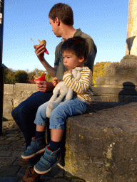 Tim and Max with an ice cream in front of the Église Saint-Nicolas church at the Rue du Comte Théodule d`Ursel street