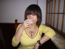 Miaomiao drinking tea in a Korean restaurant