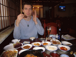 Tim having dinner in a Korean restaurant