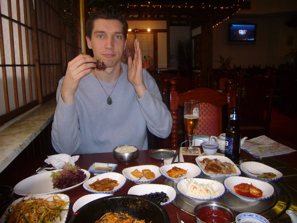 Tim having dinner in a Korean restaurant