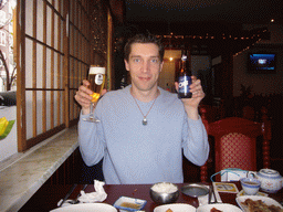 Tim drinking OB beer in a Korean restaurant