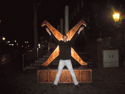 Tim with a wooden statue in the Rheinstraße street