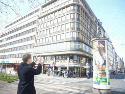 Tim and an advertisement pillar at the Konrad-Adenauer-Platz square