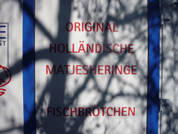 Sign with dutch herring at the Carlsplatz square