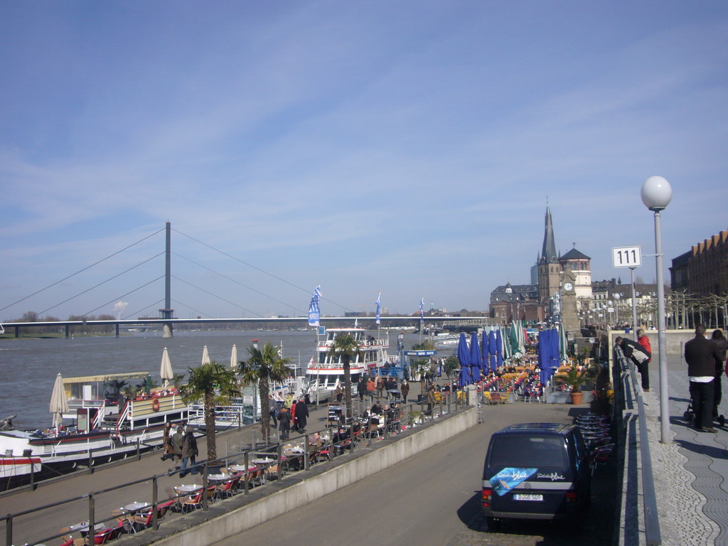 The Rhine shore, with a view on the Oberkasseler Brücke bridge, the Pegeluhr clock, the Old Castle Tower and the Lambertuskirche church