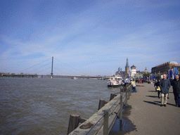 The Rhine shore, with a view on the Oberkasseler Brücke bridge, the Pegeluhr clock, the Old Castle Tower and the Lambertuskirche church