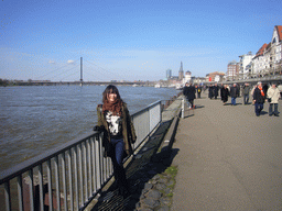 Miaomiao at the Rhine shore, with the Oberkasseler Brücke bridge, the Old Castle Tower and the Lambertuskirche church