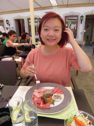 Miaomiao having lunch at the De La Basilique restaurant at the northeast side of the Place du Marché square
