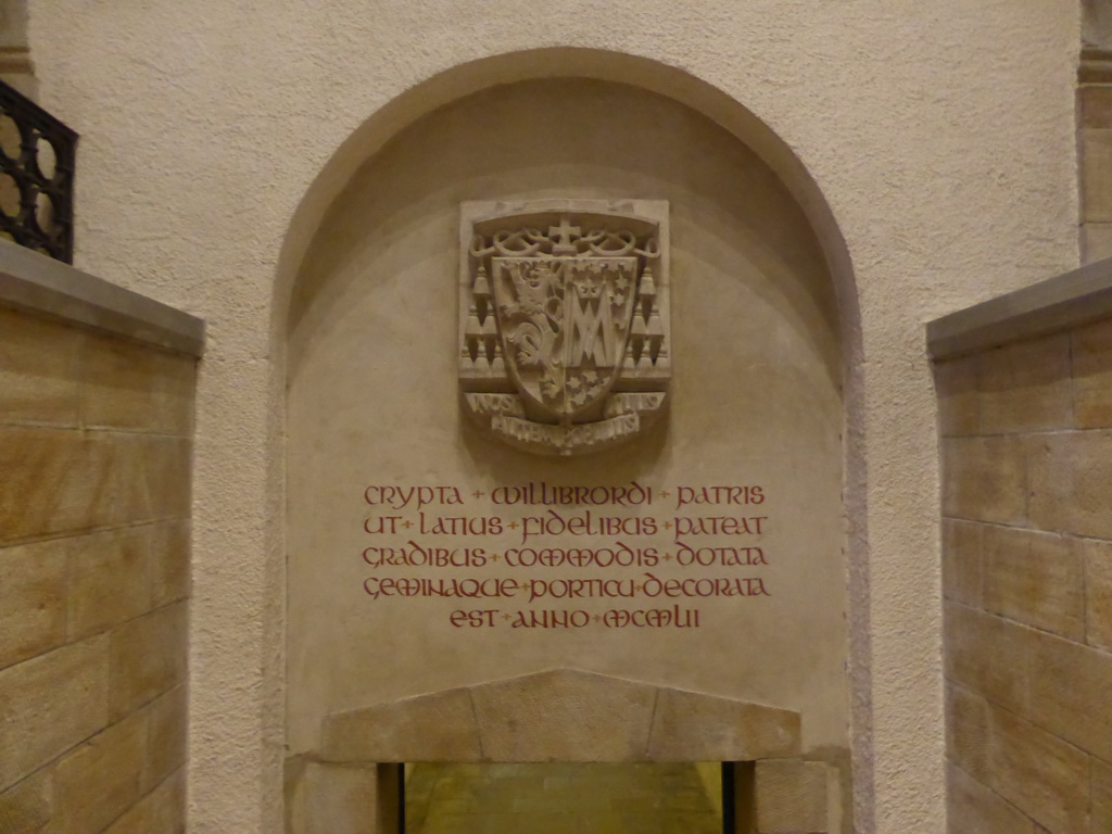 Relief and inscription above the door to the crypt of the Basilica of St. Willibrord