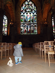 Max and stained glass windows at the east side of the nave of St. Giles` Cathedral