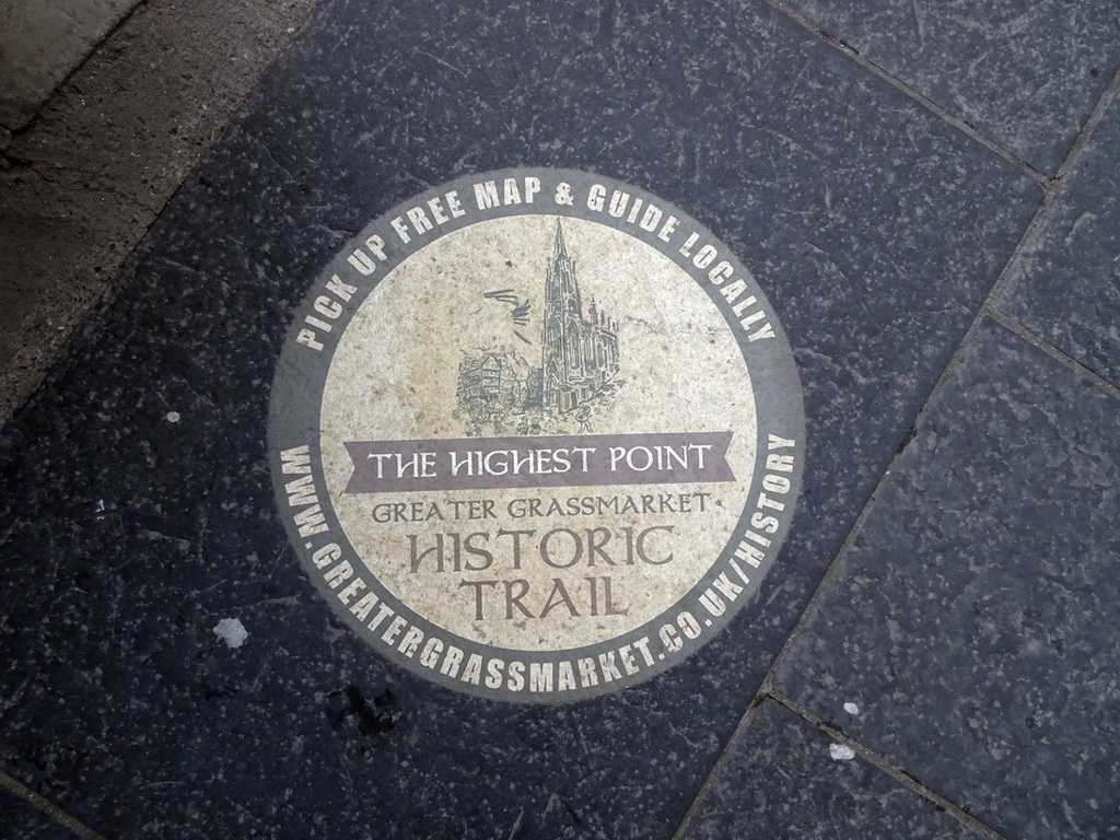 Street tile `The Highest Point` of the Greater Grassmarket Historic Trail, in front of the Hub at the crossing of the Johnston Terrace and the Royal Mile