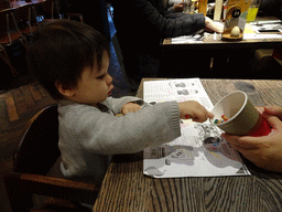 Max playing with pencils at the Nando`s Edinburgh Chambers Street restaurant