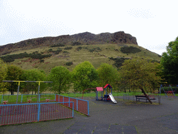 Playground at Dumbiedykes Road, with a view on Holyrood Park with the Salisbury Crags