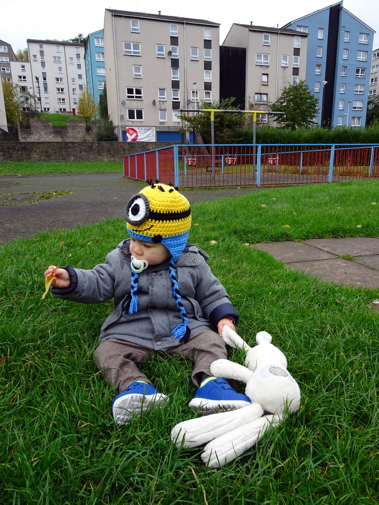 Max in the grass at the playground at Dumbiedykes Road