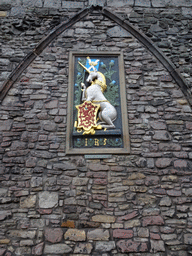 Heraldic panel from the entrance to the former gatehouse of the Palace of Holyroodhouse, on the wall at the Abbey Strand, with explanation