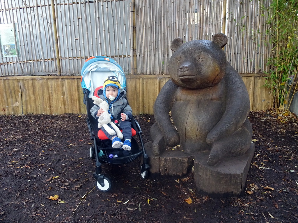 Max with a statue of a Giant Panda at the Giant Panda Exhibit at the Edinburgh Zoo