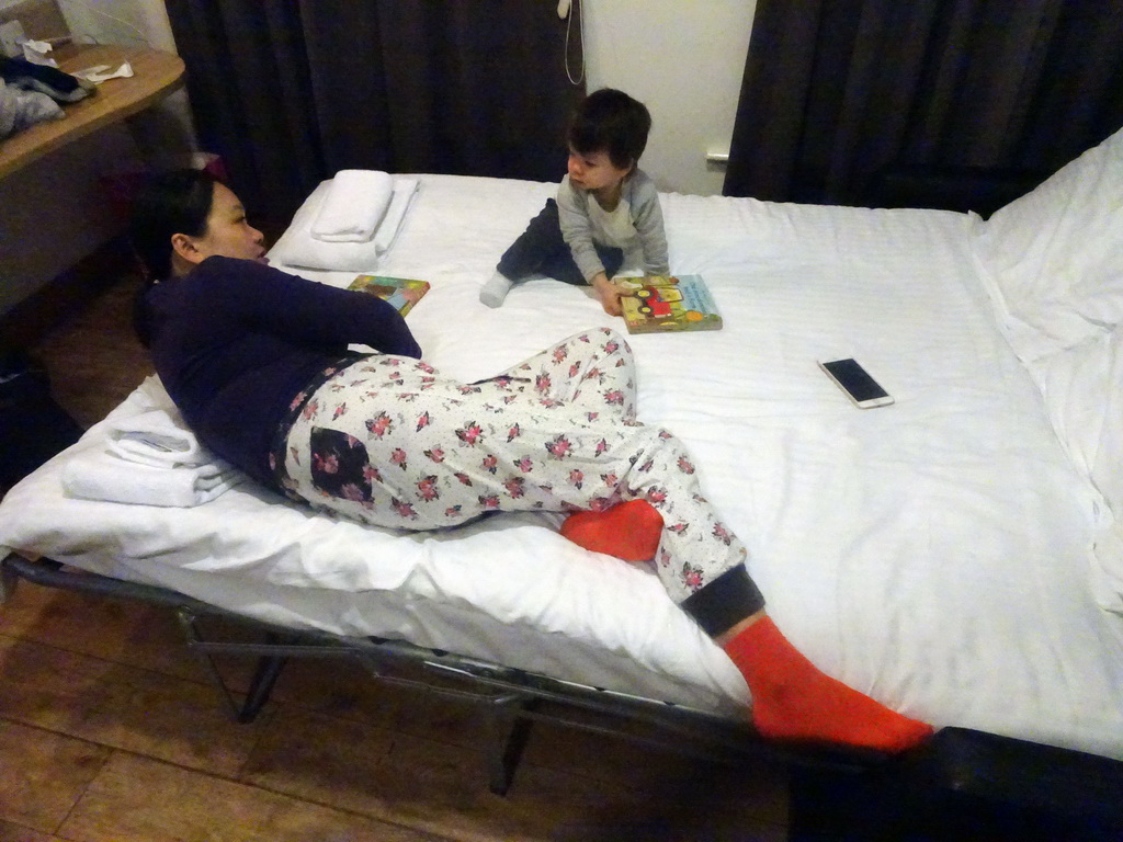 Miaomiao and Max on the bed in the living room of our second apartment at Richmond Place Apartments