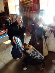 Miaomiao and Max with women in traditional clothing in the Great Hall at Edinburgh Castle