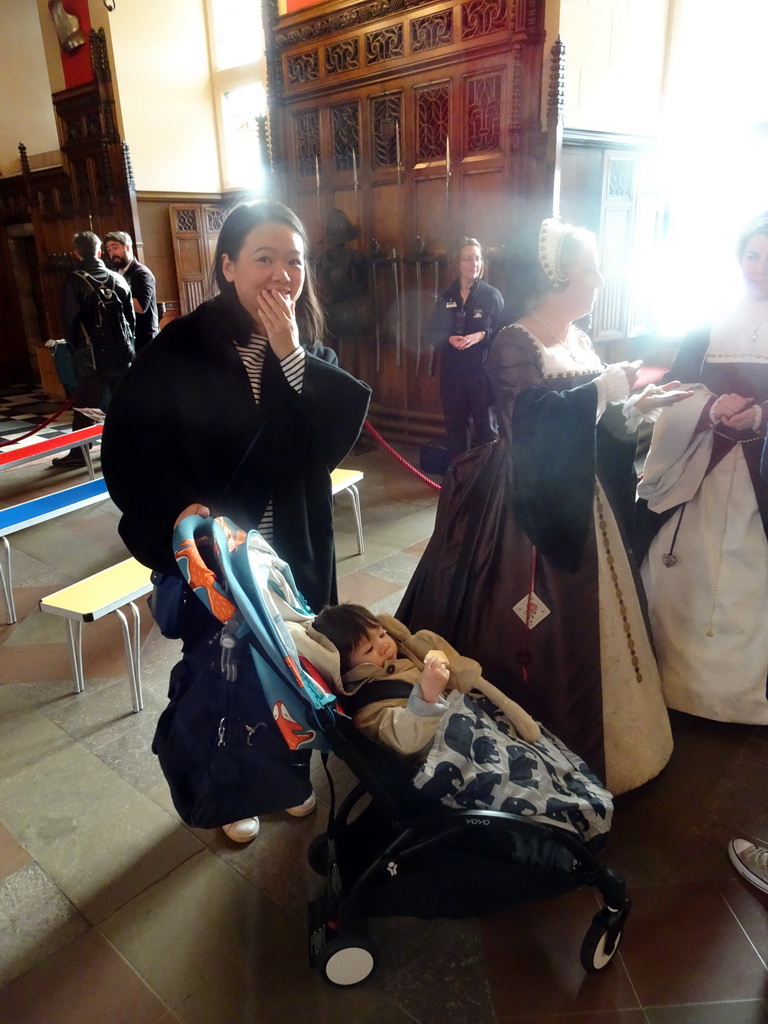 Miaomiao and Max with women in traditional clothing in the Great Hall at Edinburgh Castle