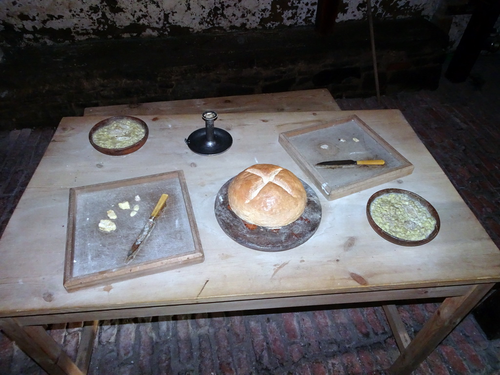 Table with food in a prison cell at the Prisons of War Exhibition building at Edinburgh Castle