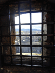 A window at Dury`s Battery at Edinburgh Castle, with a view on the southwest side of the city