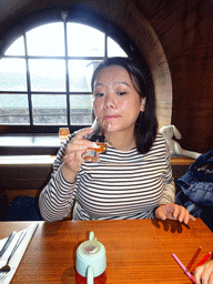 Miaomiao drinking whiskey at the Amber Restaurant at the Scotch Whisky Experience