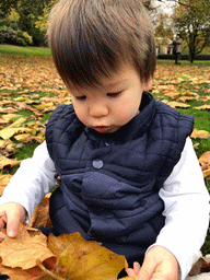 Max playing with leaves at the Princes Street Gardens