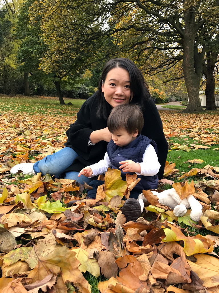 Miaomiao and Max playing with leaves at the Princes Street Gardens