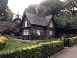 The Greenskeeper`s Cottage and the statue of Allan Ramsay at the Princes Street Gardens